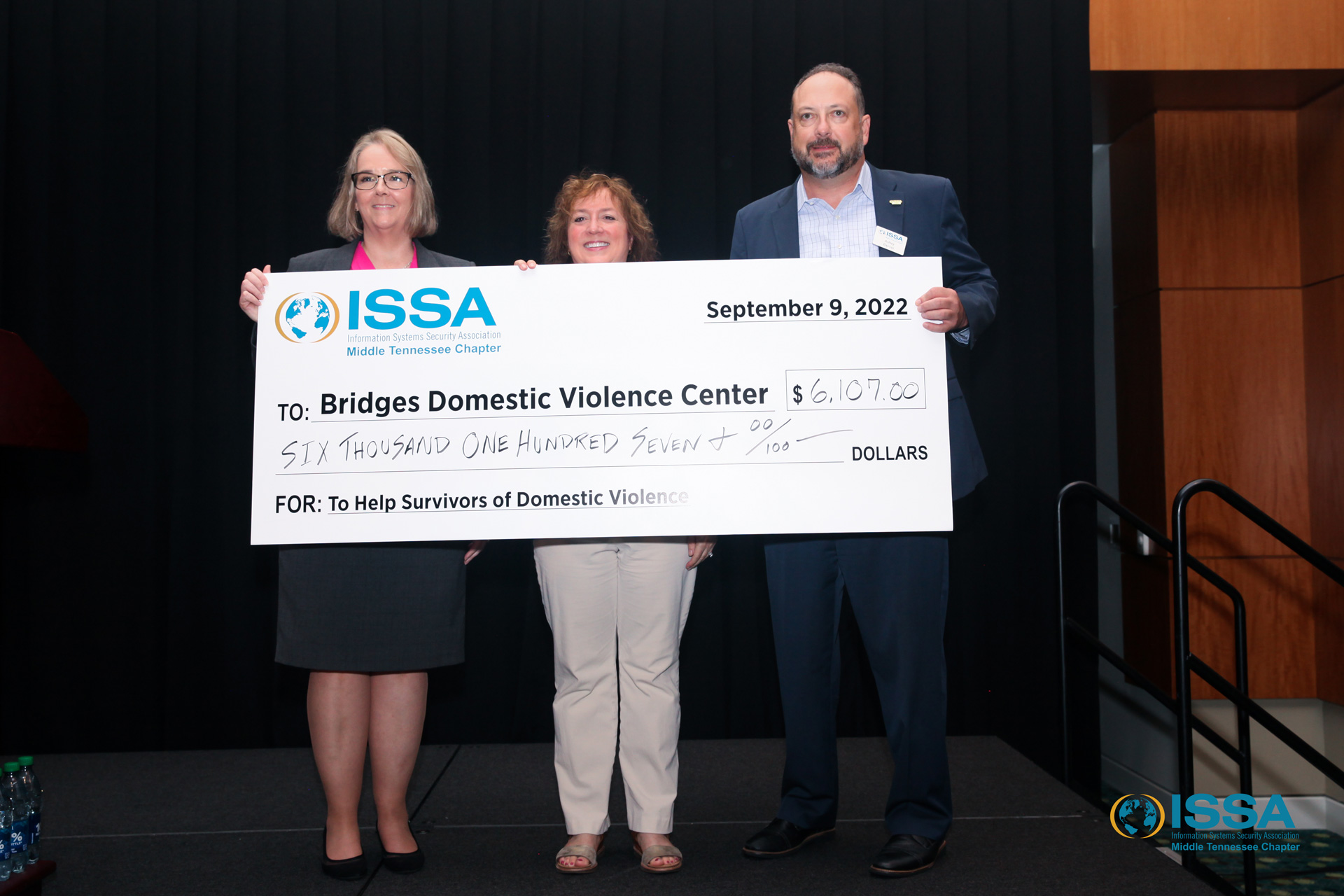 ISSA of Middle Tennessee presents a check to Bridges Domestic Violence Center